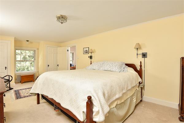 25 Chesterfield Road Milton, MA 02186 - Photo 19 of 27 a bed room with a bed and a table