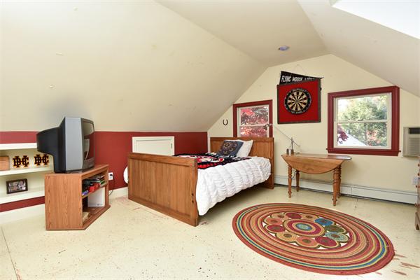 25 Chesterfield Road Milton, MA 02186 - Photo 23 of 27 a bedroom with furniture and a bed