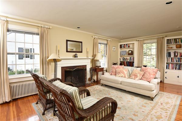 25 Chesterfield Road Milton, MA 02186 - Photo 3 of 27 a living room with furniture a fireplace and a large window