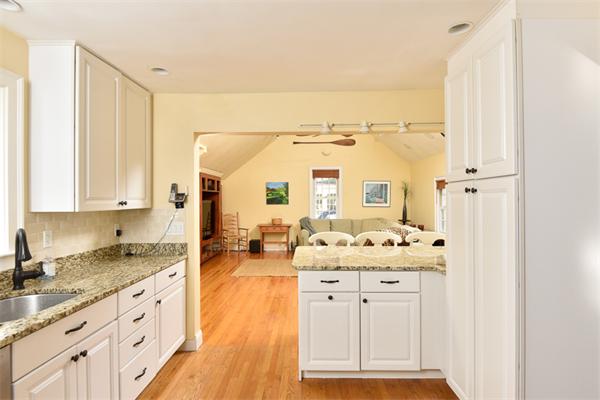 25 Chesterfield Road Milton, MA 02186 - Photo 8 of 27 a spacious bathroom with a granite countertop sink and a mirror