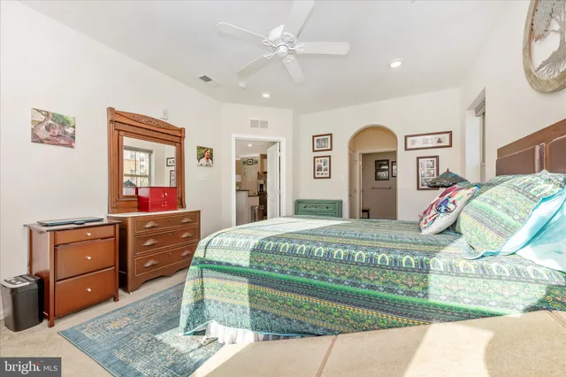 a bed room with a bed and a dresser