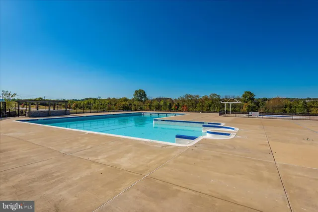 a view of a swimming pool and lake