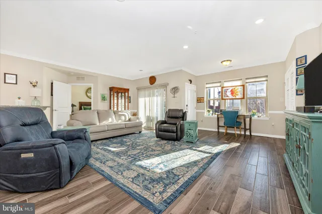 a living room with furniture and a rug