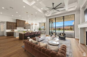 1141 East Lost Ridge Drive Washington, UT 84780 - Photo 32 of 108 Spacious open-concept interior featuring light wood-finish flooring, a coffered ceiling with recessed lighting and a large ceiling fan, and extensive floor-to-ceiling windows