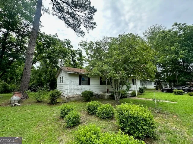 a house view with a garden space