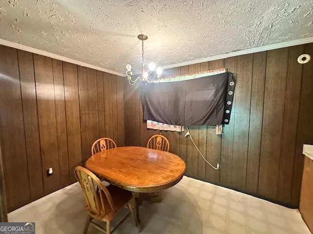 a balcony with table and chairs