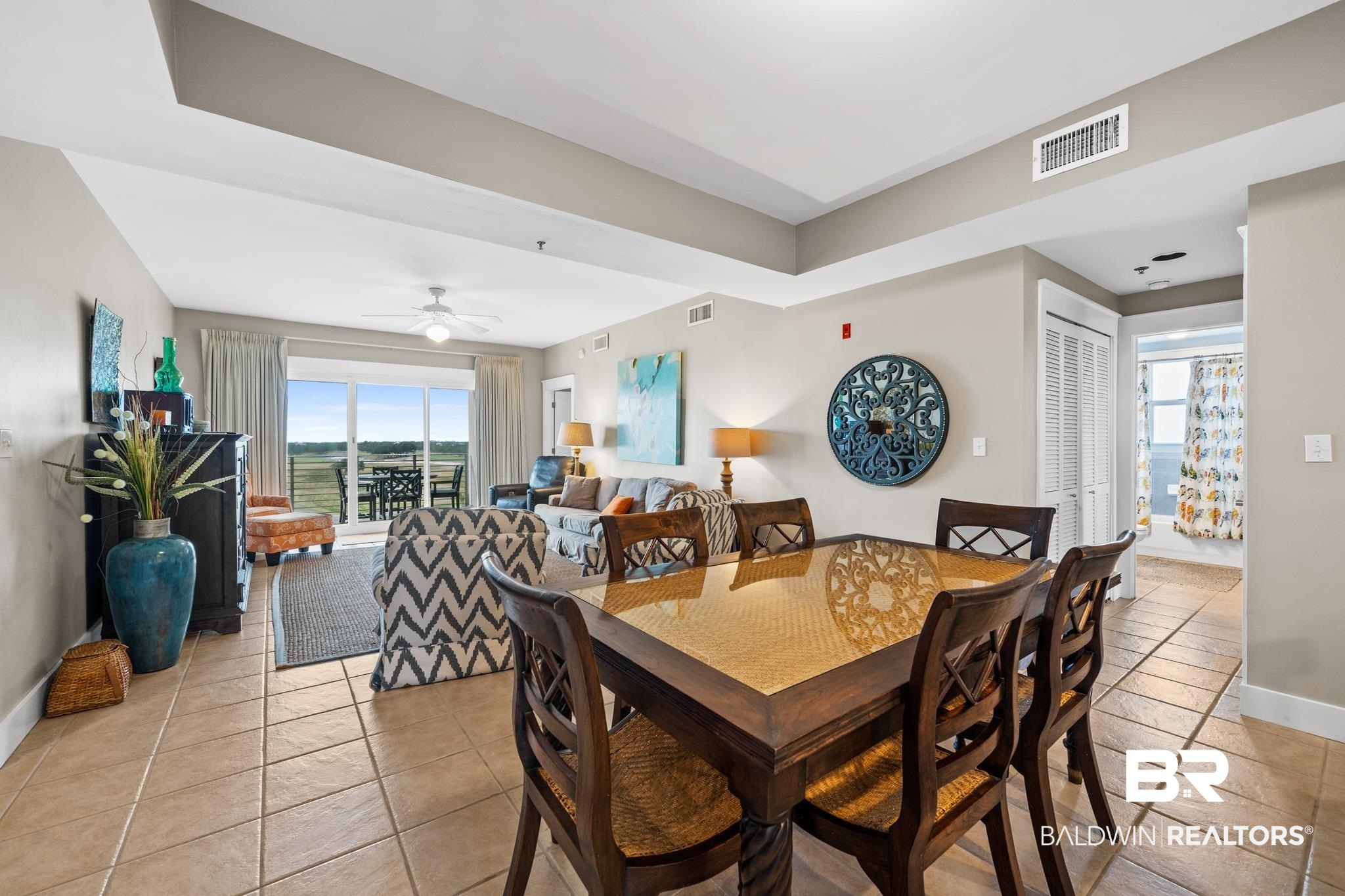 815 Plantation Road, Unit 405 Gulf Shores, AL 36542 - Photo 8 of 39 Tiled dining area featuring ceiling fan