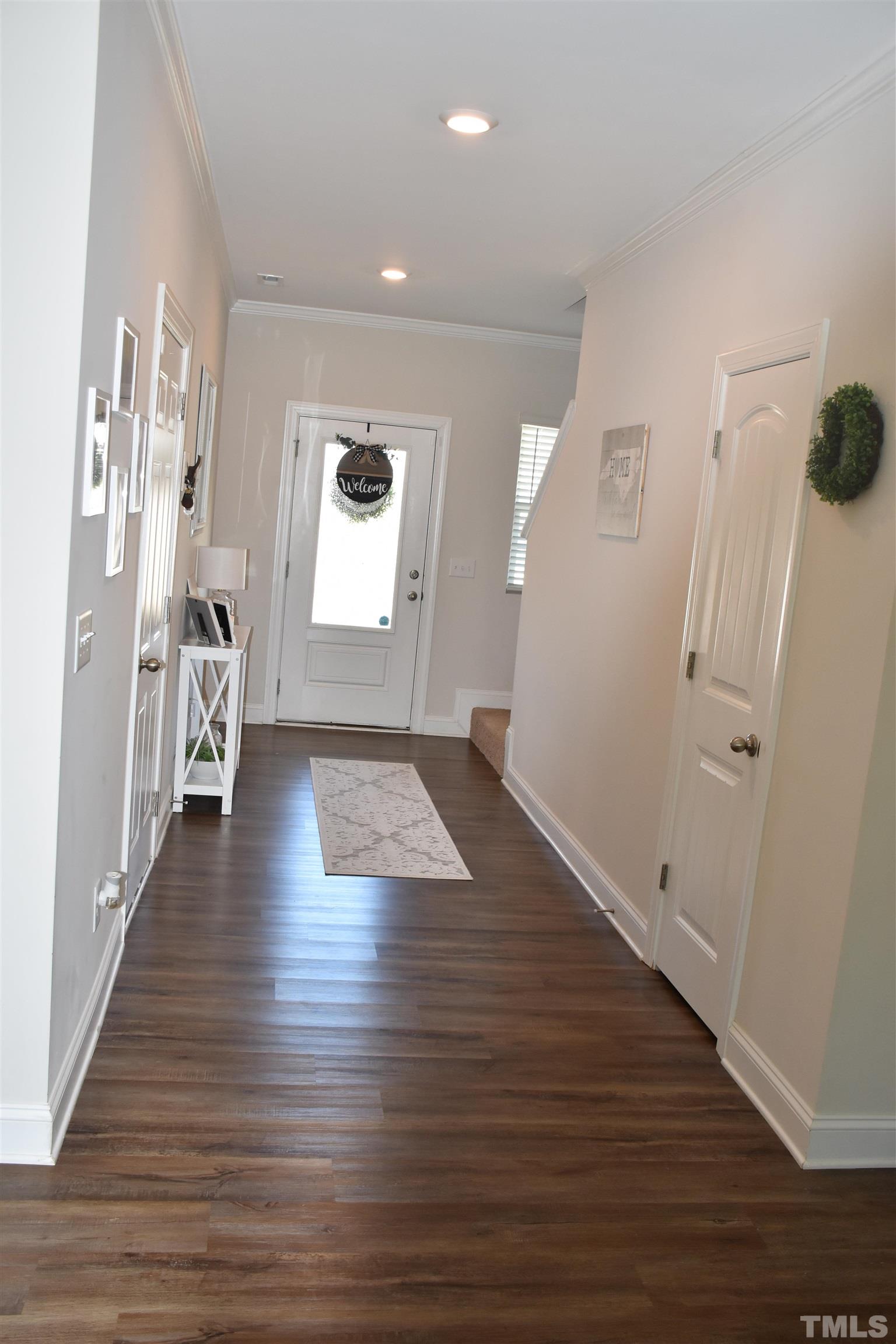 7312 Cornett Way Raleigh, NC 27604 - Photo 8 of 23 wooden floor in an empty room with a window