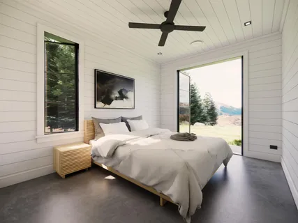 a white bath tub sitting in a bathroom next to a window