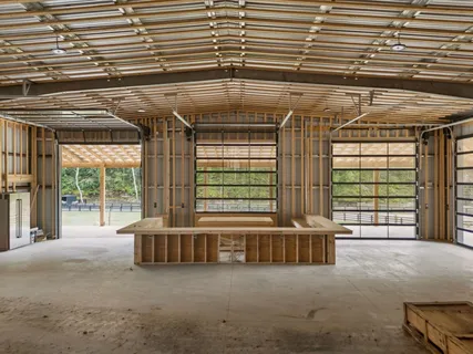 a view of a roof deck with wooden fence and a couple of chairs