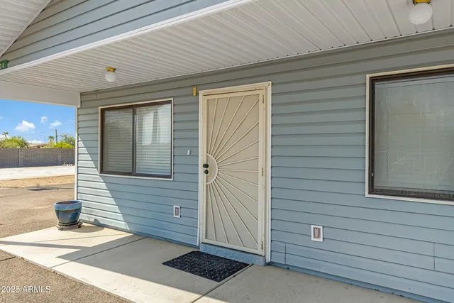 a view of a door and a window