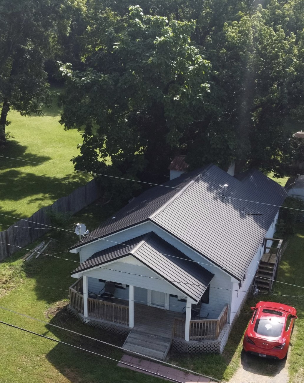 256 Walker Street Manchester, TN 37355 - Photo 12 of 14 a roof deck with table and chairs and potted plants