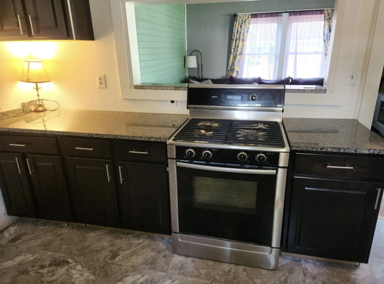 256 Walker Street Manchester, TN 37355 - Photo 5 of 14 a stove top oven sitting inside of a kitchen