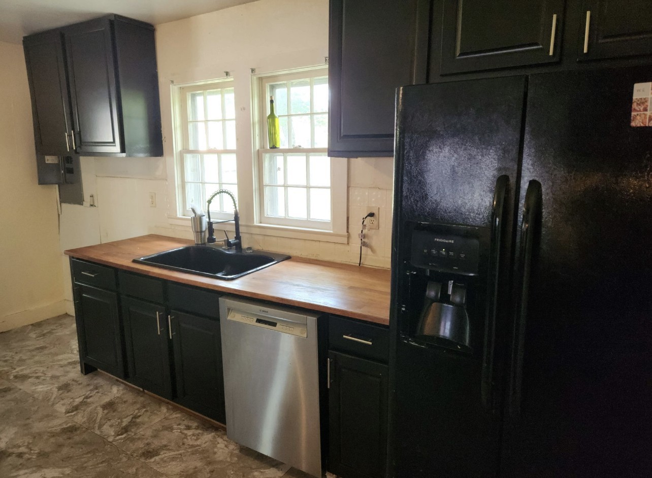 256 Walker Street Manchester, TN 37355 - Photo 6 of 14 a kitchen with a sink refrigerator and window