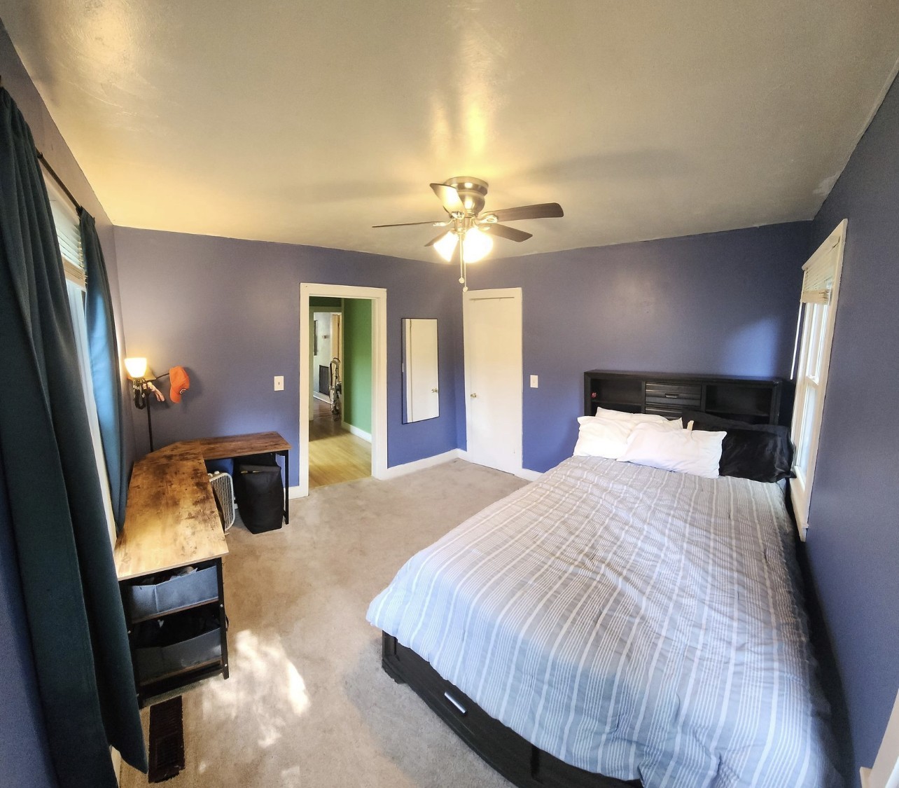 256 Walker Street Manchester, TN 37355 - Photo 8 of 14 a spacious bedroom with a bed and a chandelier