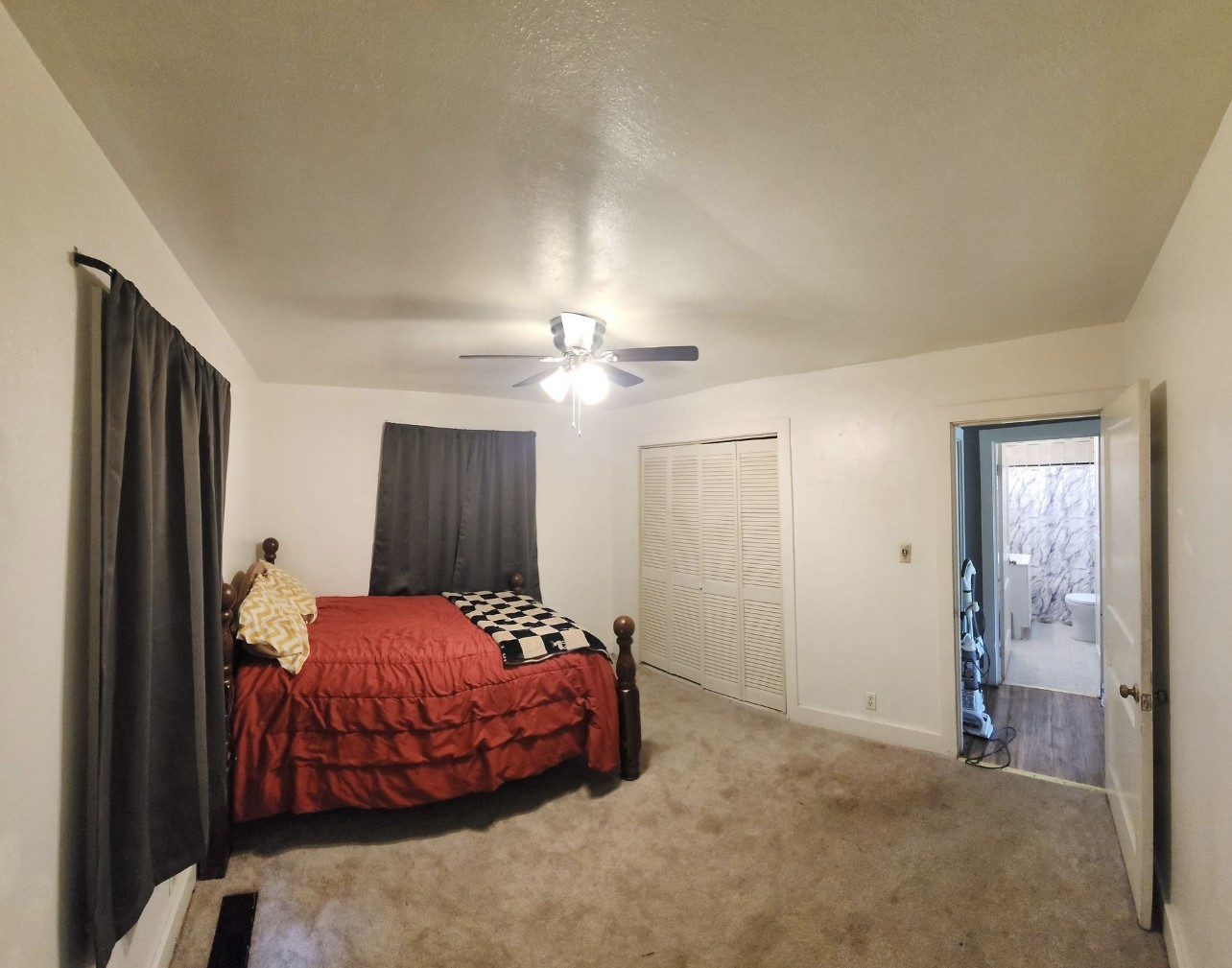 256 Walker Street Manchester, TN 37355 - Photo 10 of 14 a bedroom with a bed and a chandelier