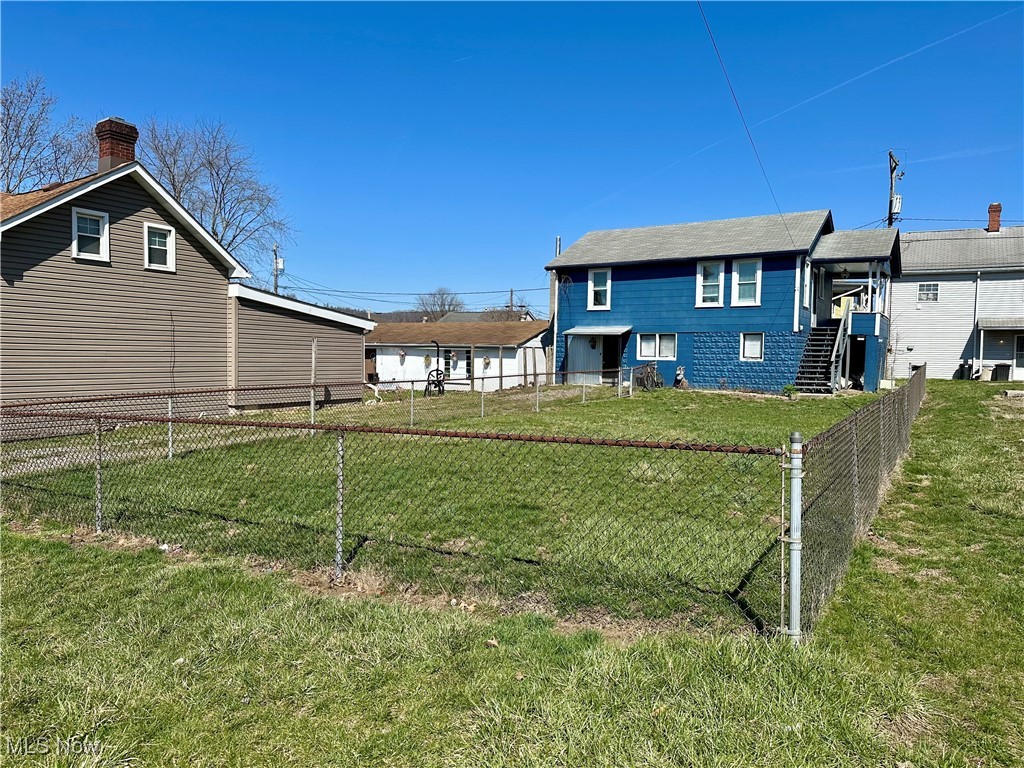 87 R 26th Street Wellsburg, WV 26070 - Photo 17 of 17 Front view of home featuring a fenced in yard