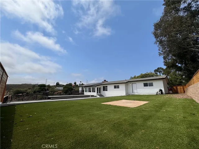 a view of a house with a big yard