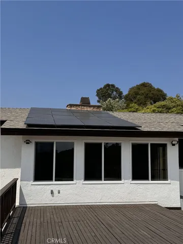 a view of a house with a large window