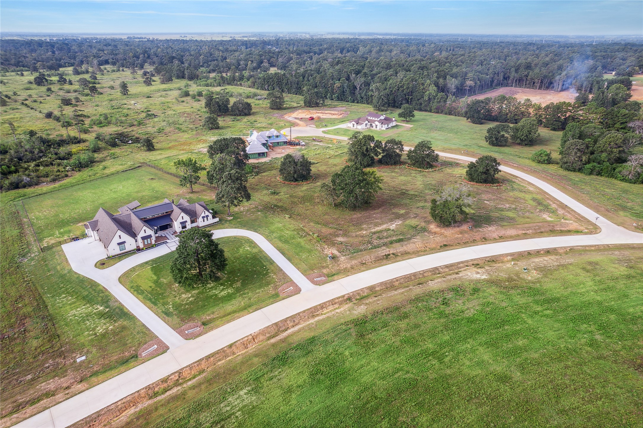 2044 Stallion Lakes Avenue Hockley, TX 77447 - Photo 14 of 17 A broad view of the surrounding custom homes and community roads. The spacing highlights the estate-style layout that makes Stallion Lakes so appealing.