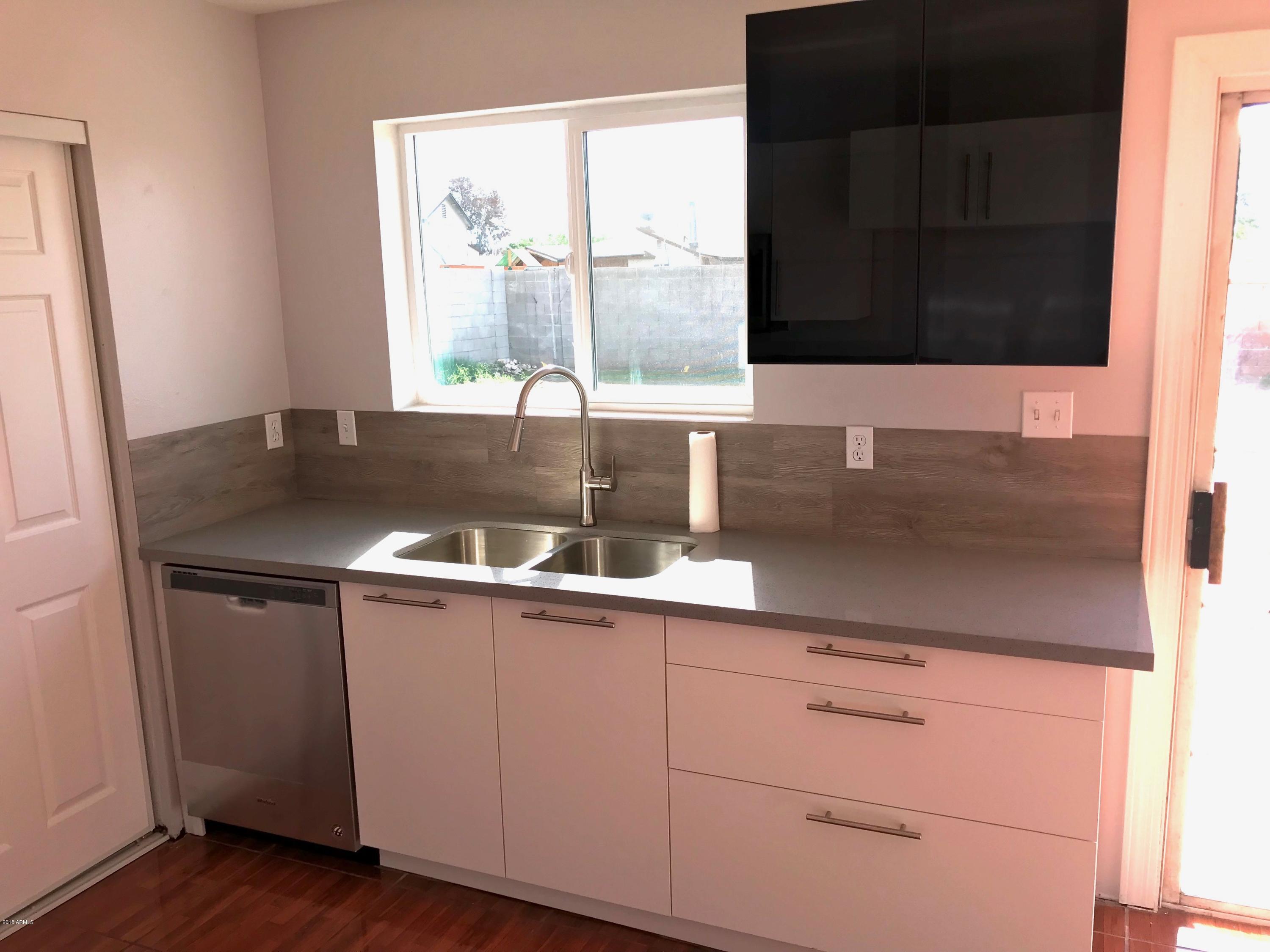 7613 West Osborn Road Phoenix, AZ 85033 - Photo 3 of 13 Kitchen facing yard
