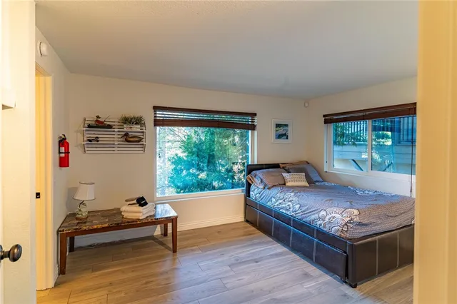 a bed room with a bed and a chair