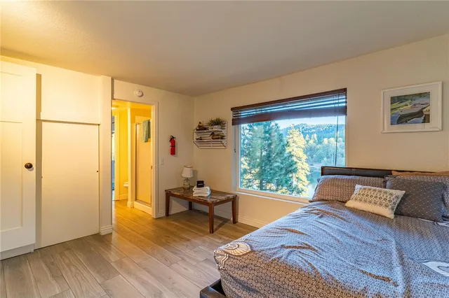 a view of hallway with wooden floor