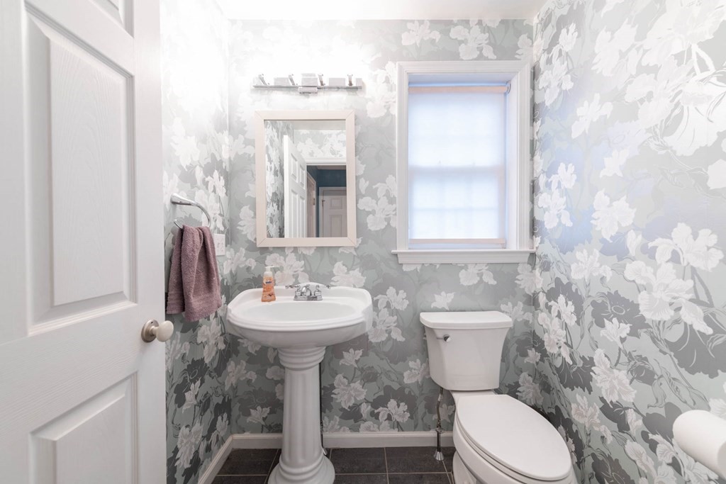 42 Willard Road Weston, MA 02493 - Photo 12 of 25 a bathroom with a toilet sink and mirror