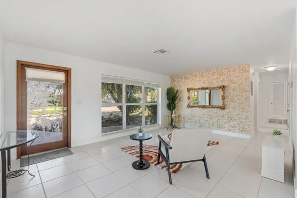 a living room with furniture and a window