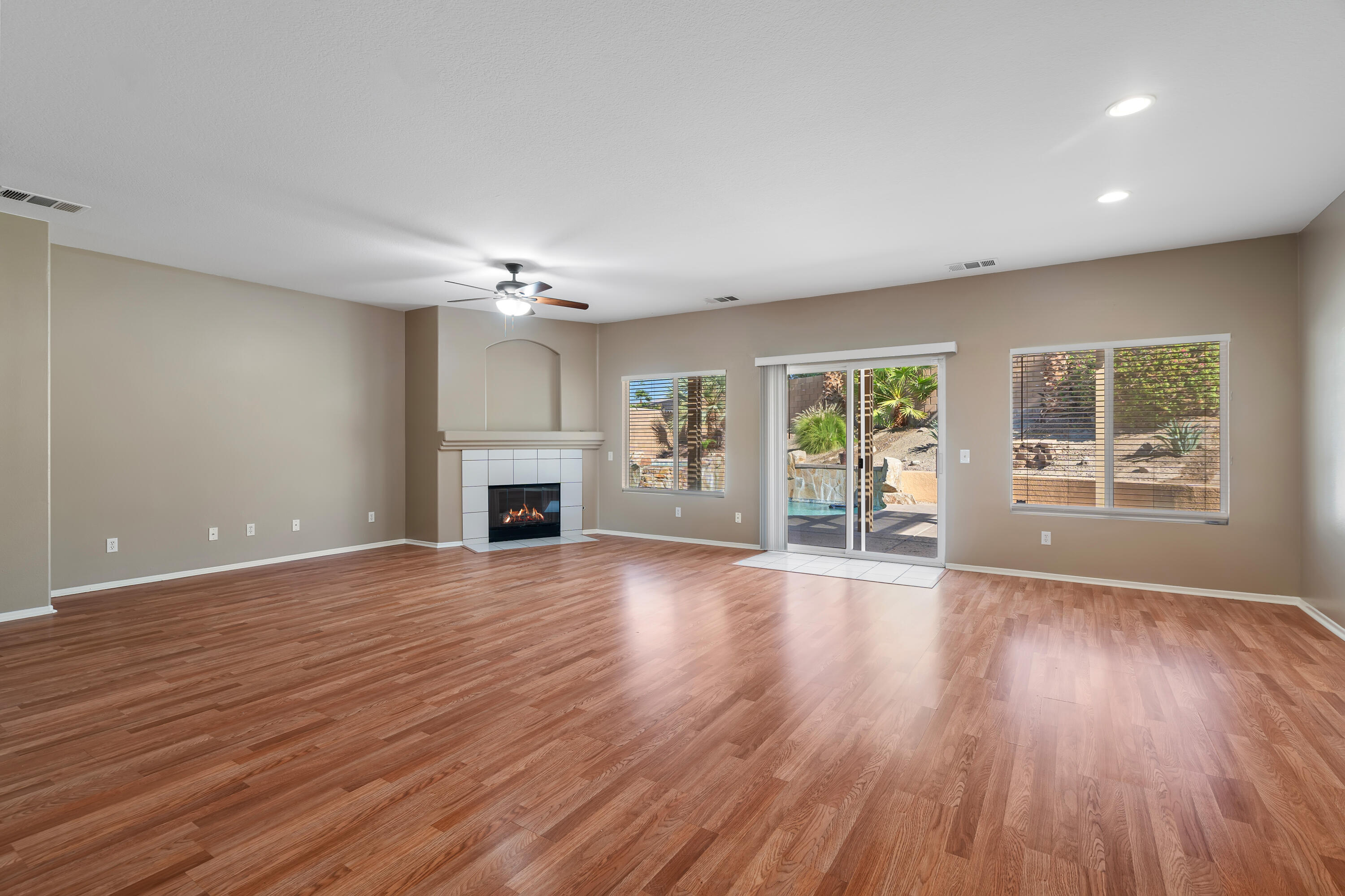 83160 Shadow Hills Way Indio, CA 92203 - Photo 11 of 50 a view of an empty room with a window and fireplace