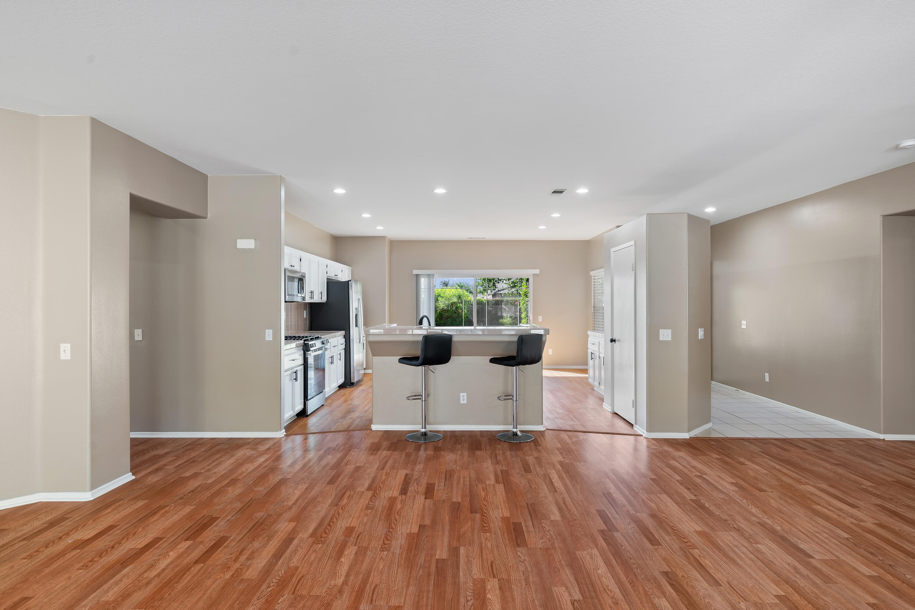 83160 Shadow Hills Way Indio, CA 92203 - Photo 14 of 50 a living room with furniture a wooden floor and a large window