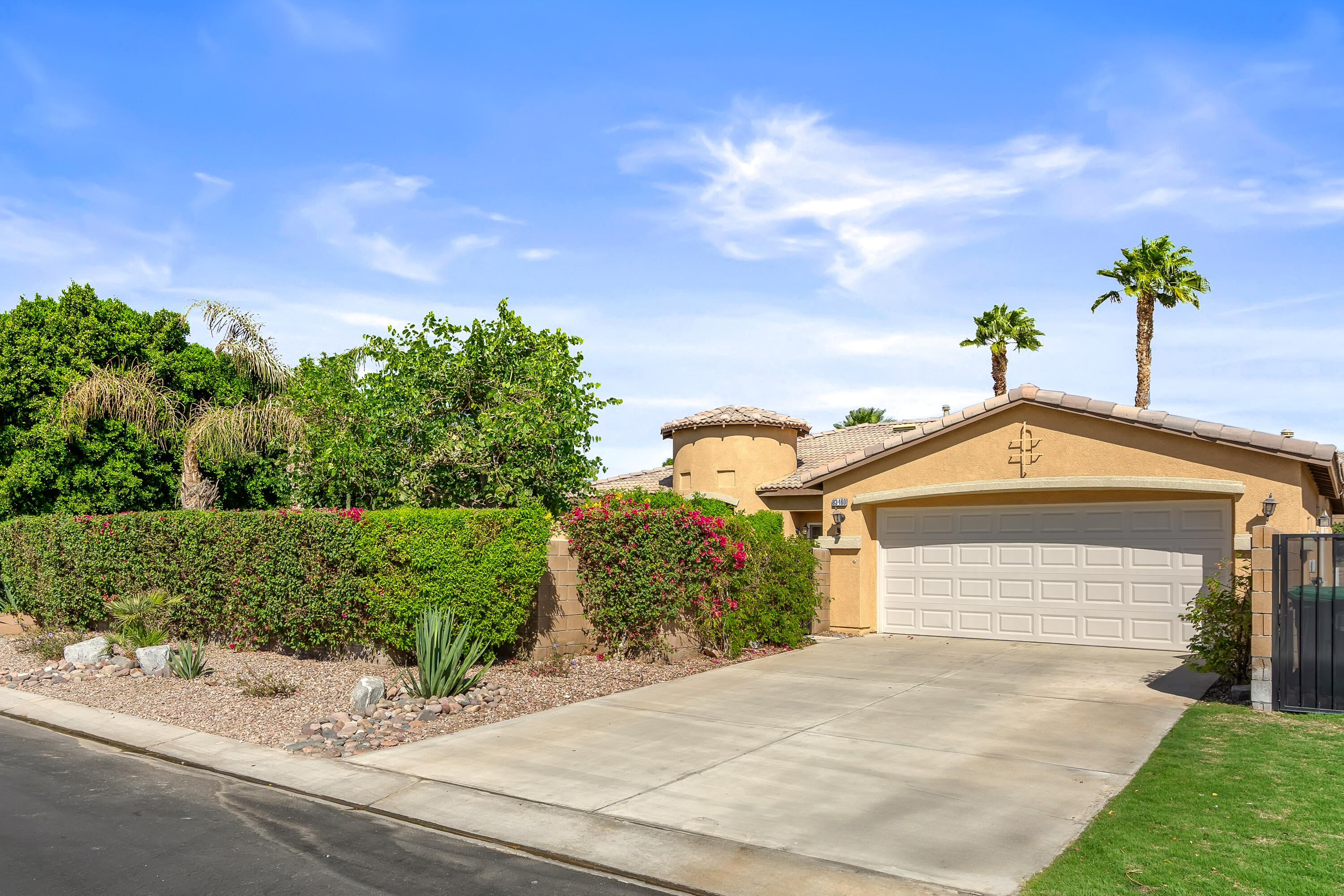 83160 Shadow Hills Way Indio, CA 92203 - Photo 2 of 50 a front view of a house with a yard
