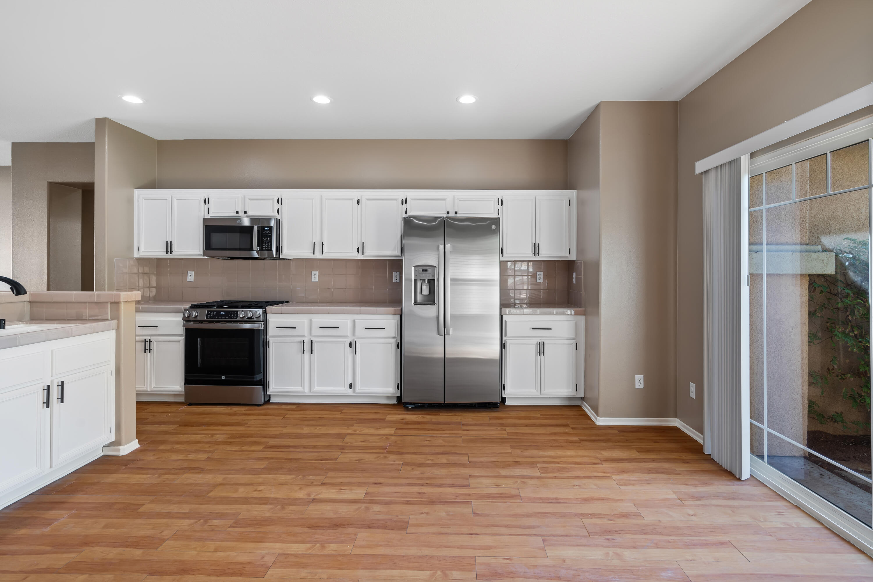 83160 Shadow Hills Way Indio, CA 92203 - Photo 22 of 50 a kitchen with stainless steel appliances a refrigerator sink and cabinets