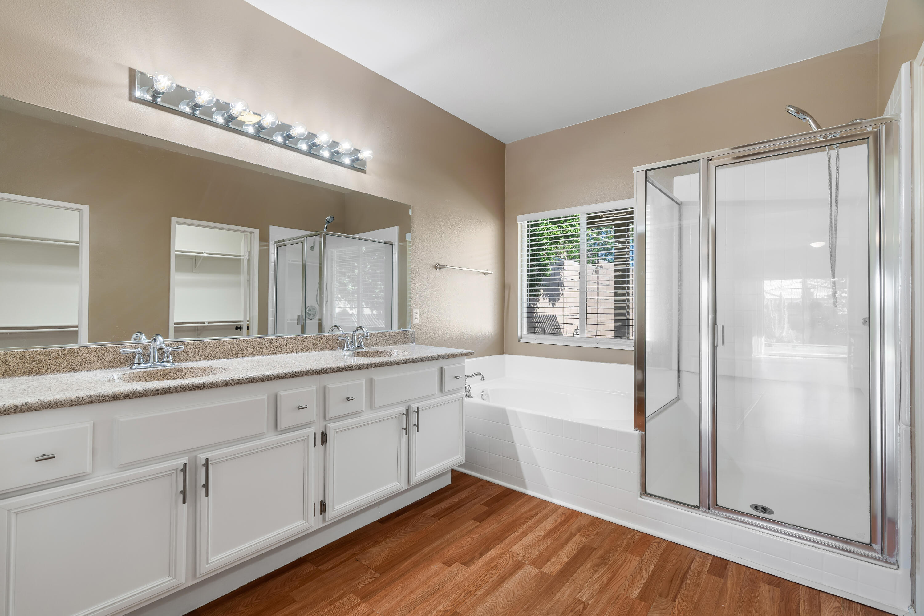 83160 Shadow Hills Way Indio, CA 92203 - Photo 29 of 50 a spacious bathroom with a double vanity sink a mirror and a bathtub