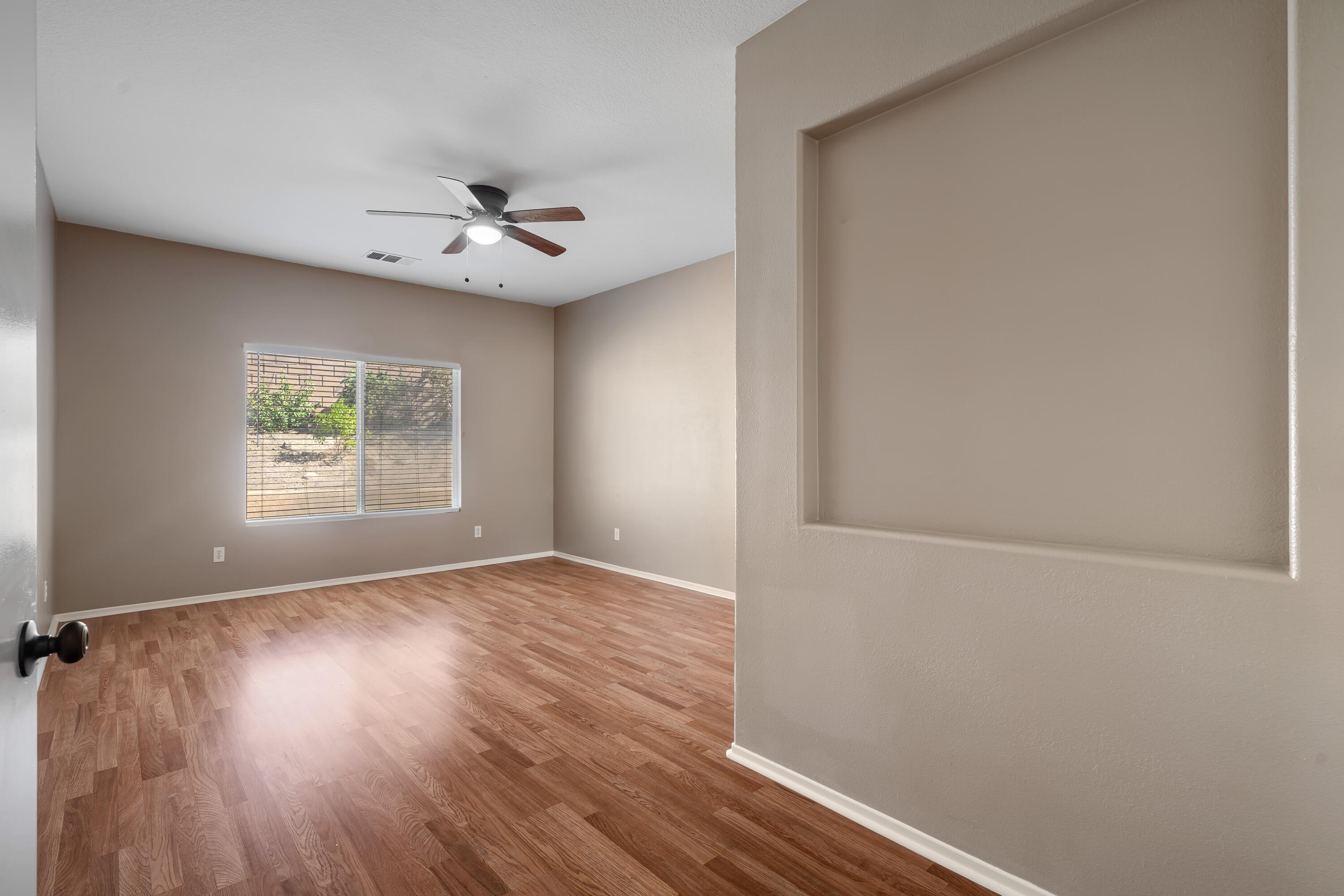 83160 Shadow Hills Way Indio, CA 92203 - Photo 33 of 50 an empty room with windows and fan
