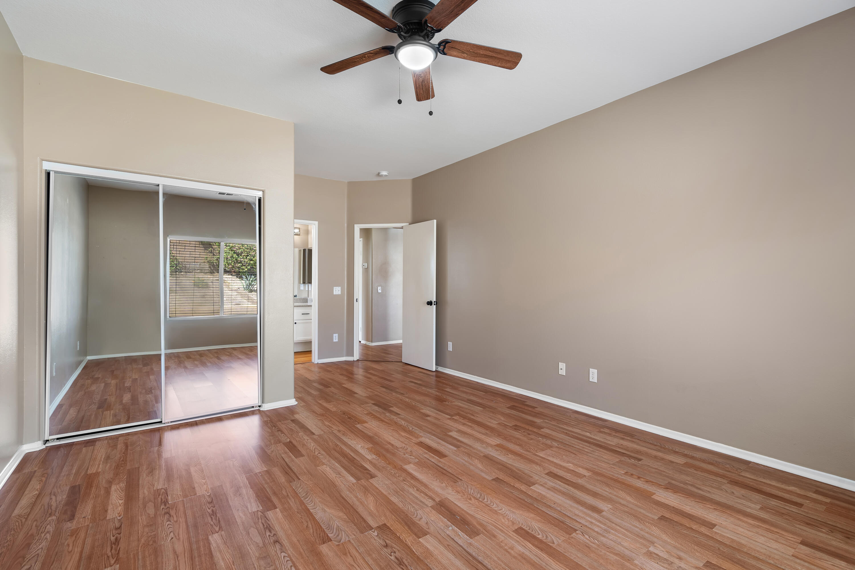 83160 Shadow Hills Way Indio, CA 92203 - Photo 34 of 50 wooden floor in an empty room with a window