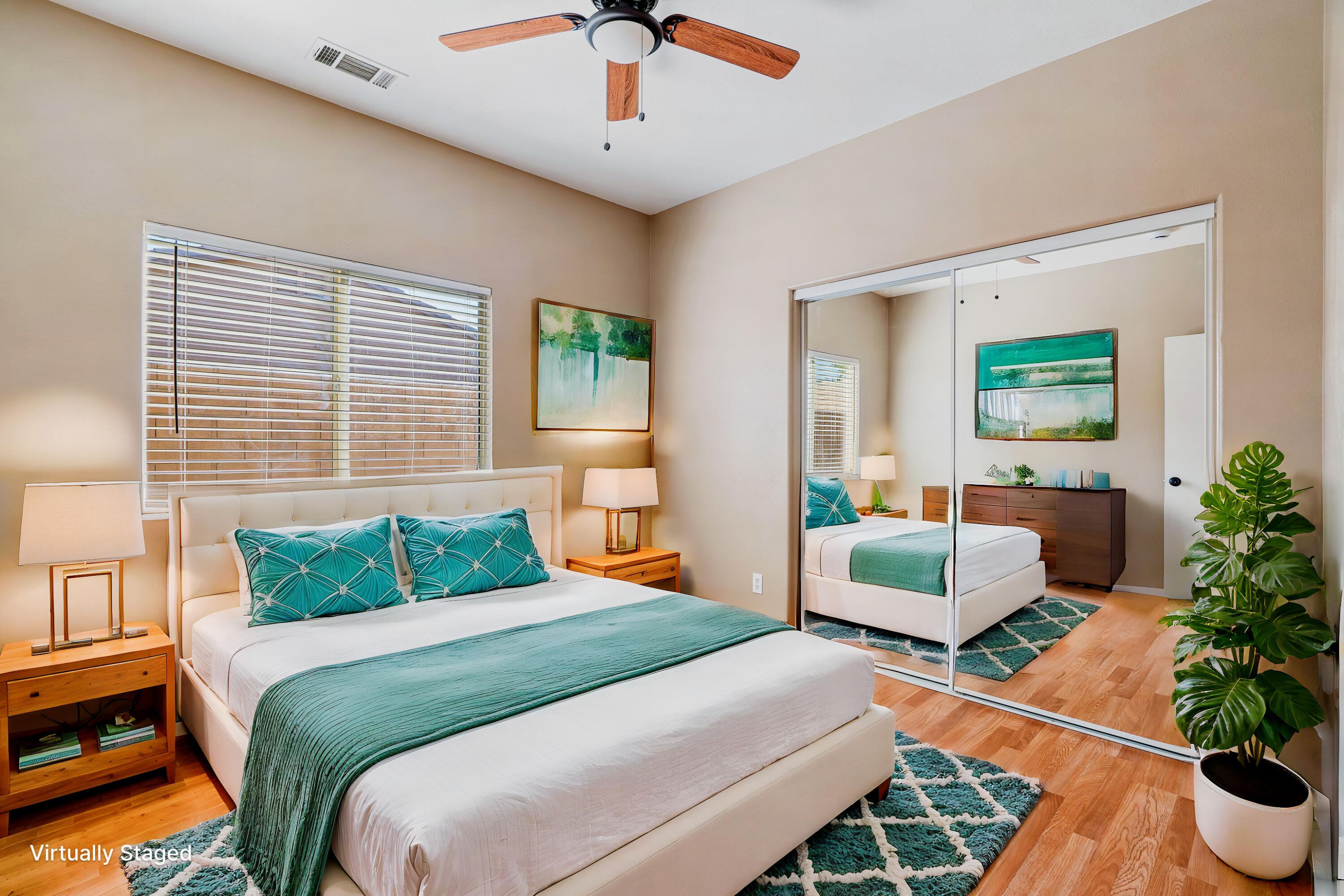 83160 Shadow Hills Way Indio, CA 92203 - Photo 39 of 50 a bedroom with a large bed and a potted plant