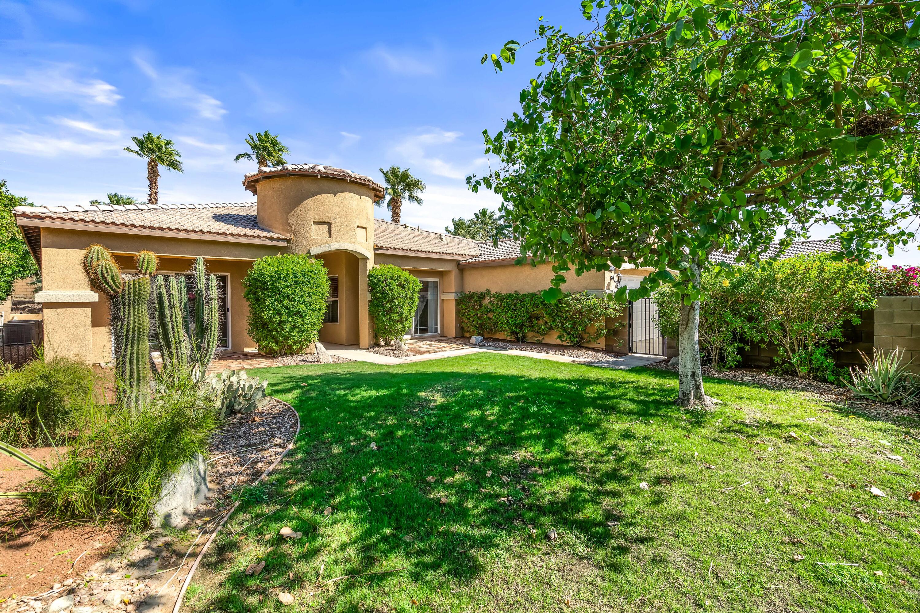 83160 Shadow Hills Way Indio, CA 92203 - Photo 4 of 50 a front view of a house with garden