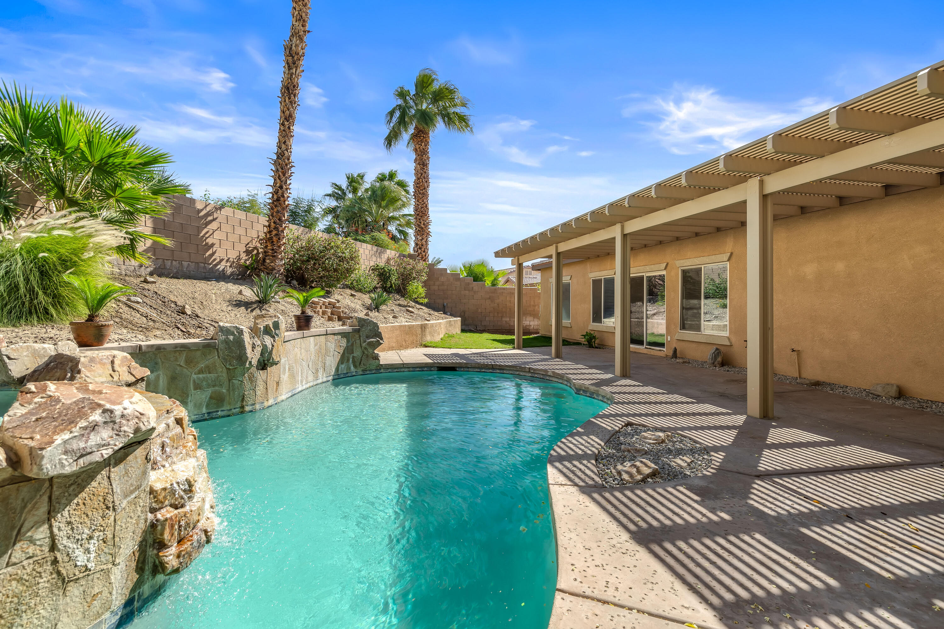83160 Shadow Hills Way Indio, CA 92203 - Photo 43 of 50 a swimming pool with outdoor seating and yard