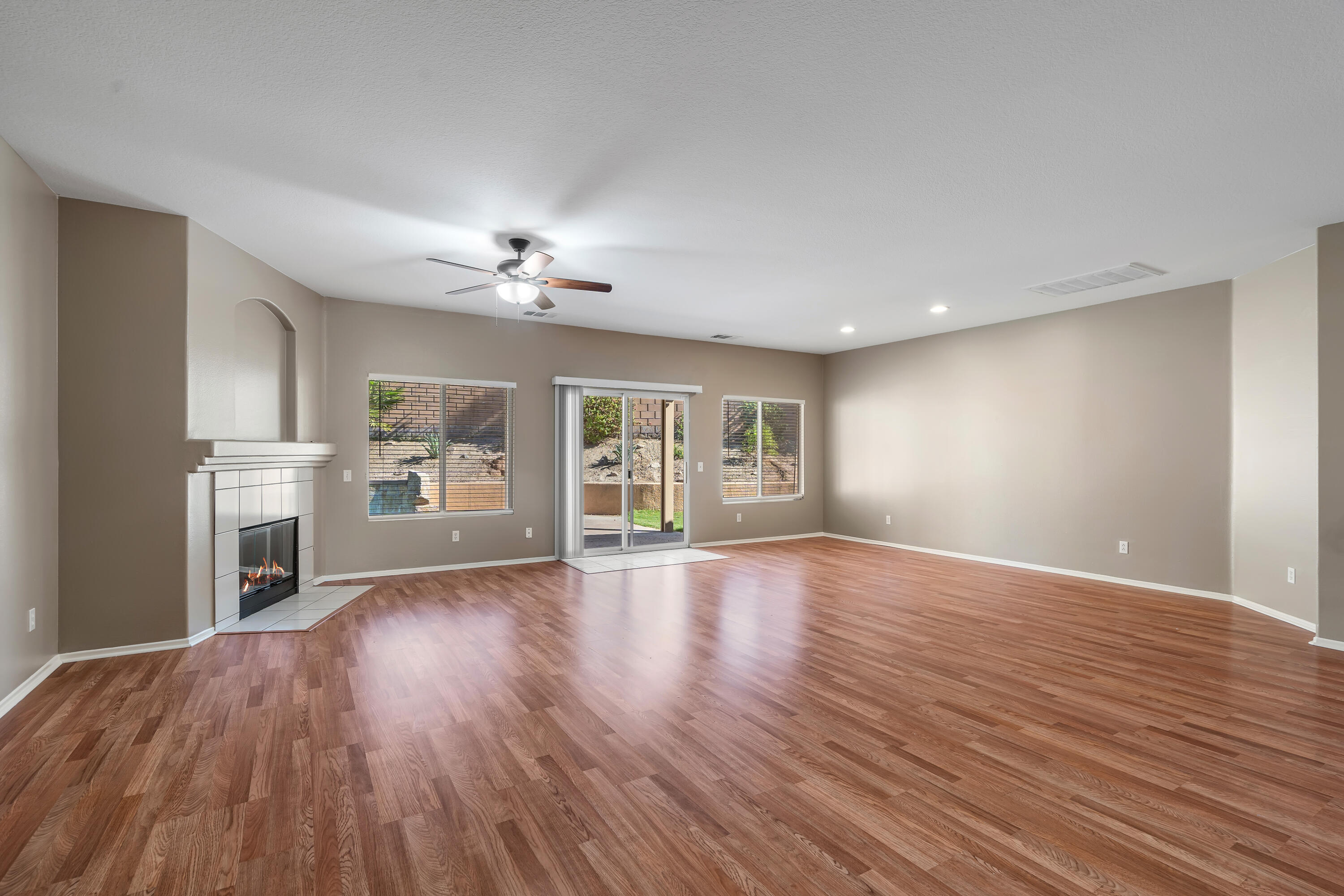 83160 Shadow Hills Way Indio, CA 92203 - Photo 9 of 50 a view of an empty room with window and wooden floor