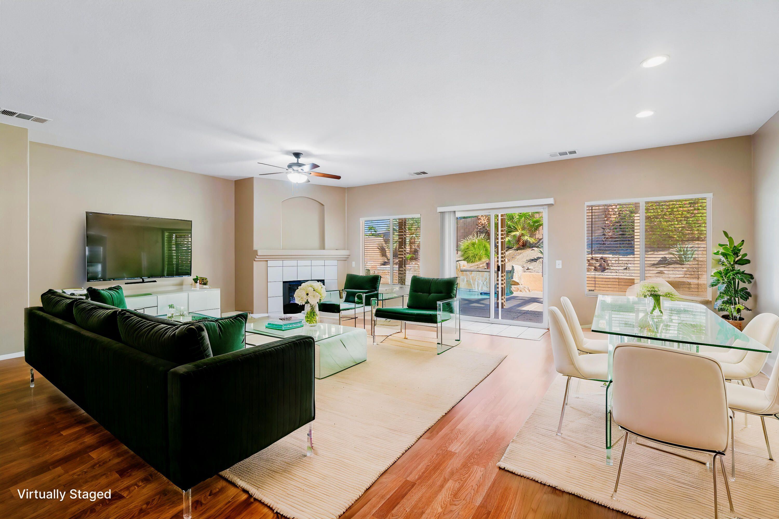 83160 Shadow Hills Way Indio, CA 92203 - Photo 10 of 50 a living room with furniture a large window and a wooden floor