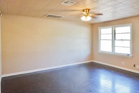 4425 Harding Drive Beaumont, TX 77703 - Photo 4 of 16 wooden floor in an empty room with a window