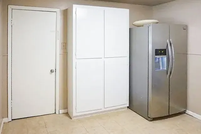 a view of a room with a refrigerator