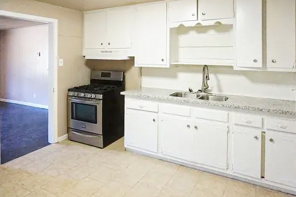 4425 Harding Drive Beaumont, TX 77703 - Photo 7 of 16 a kitchen with stainless steel appliances granite countertop a sink stove and cabinets