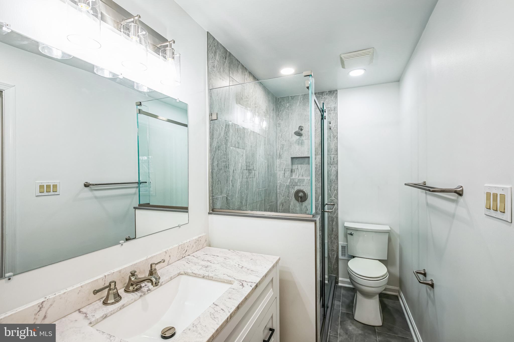 1772 Dryden Way Crofton, MD 21114 - Photo 16 of 34 a bathroom with a sink toilet and shower
