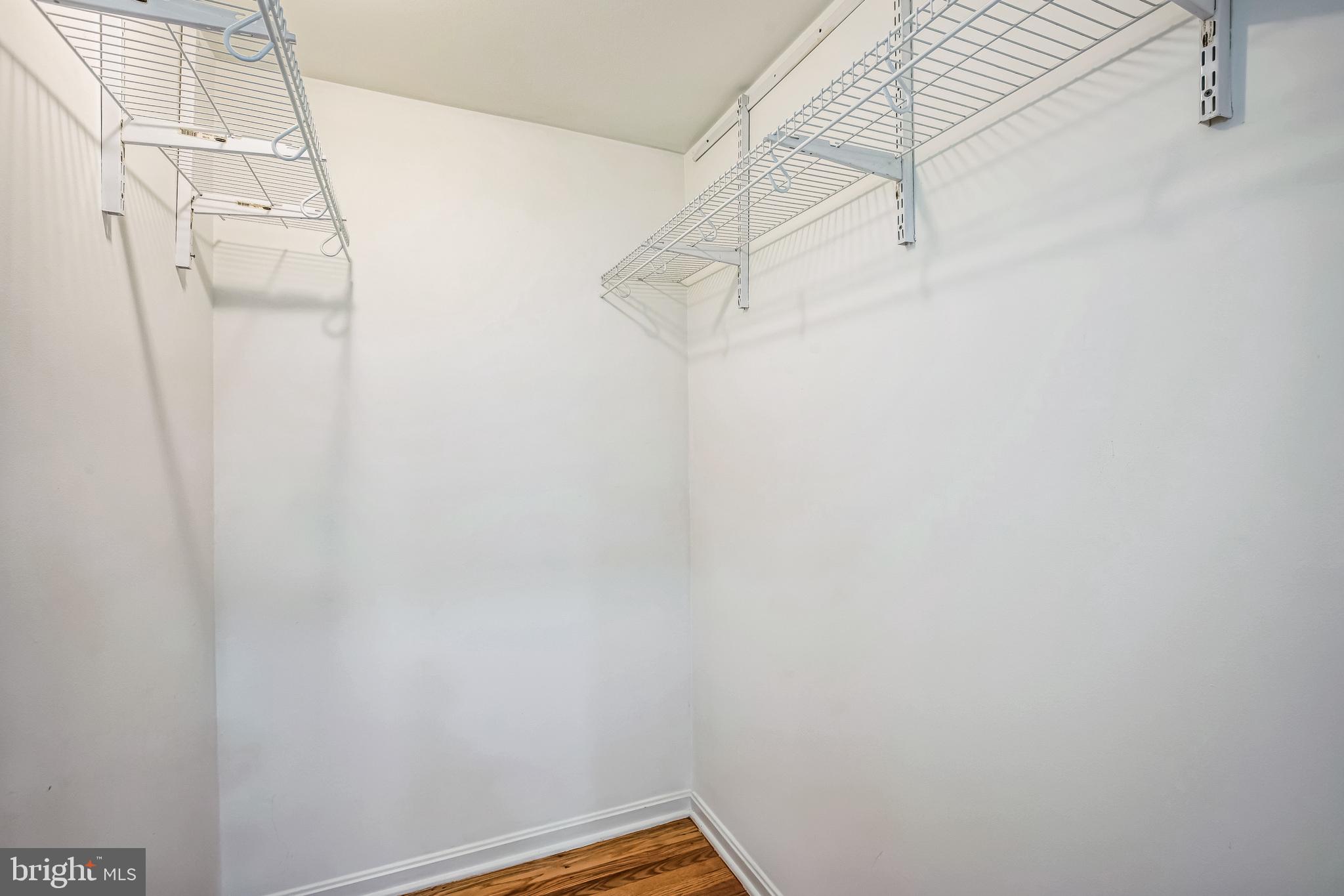 1772 Dryden Way Crofton, MD 21114 - Photo 17 of 34 a view of small space with empty racks on the wall