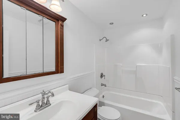 a bathroom with a sink and a bathtub