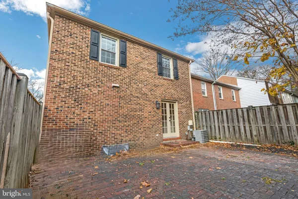 a view of a brick house with a street