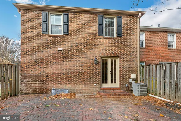 a brick building with a door and a window