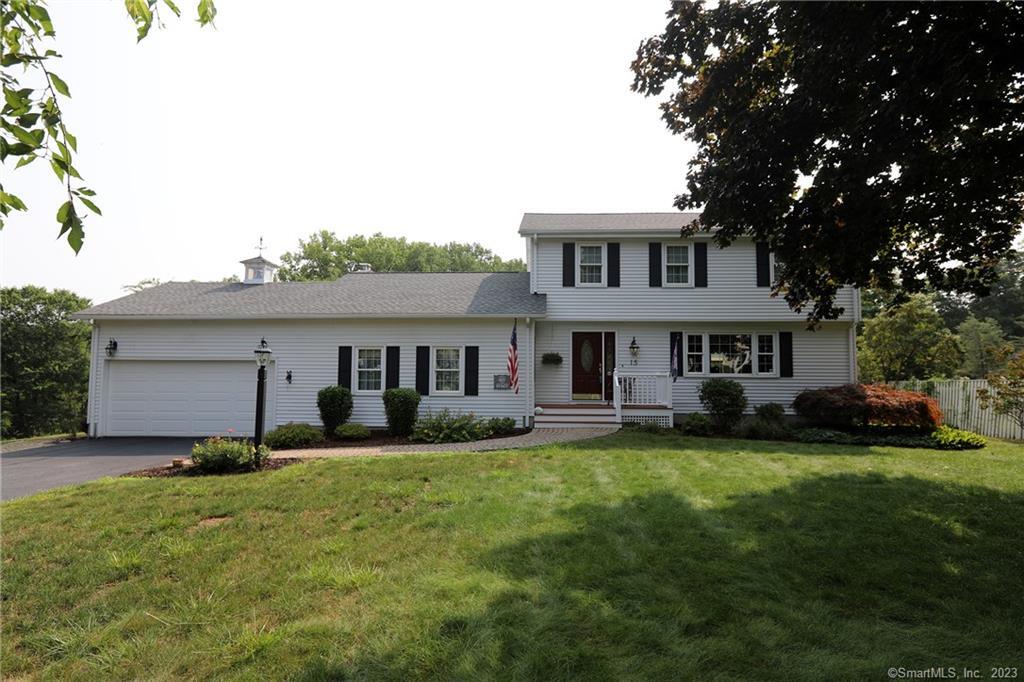 15 Bent Road Windsor, CT 06095 - Photo 1 of 1 a house that has a big yard with wooden fence